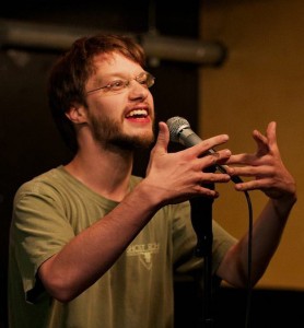 Nathan Comstock performs at the Wednesday open mic. Photo by Vasant Marur.