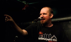Adam Stone performs at the Cantab Lounge during the 2011 National Poetry Slam. Photo by Mark Skrzypczak.