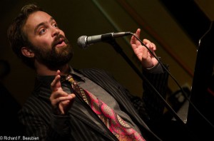 Andrew Campana takes the stage as the featured poet on October 15, 2014. Photo by Rich Beaubien.