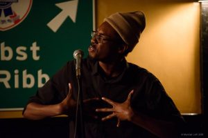 Evan Jymaal Cutts performs in the 2018 Boston Poetry Slam Team series. Photo by Marshall Goff.
